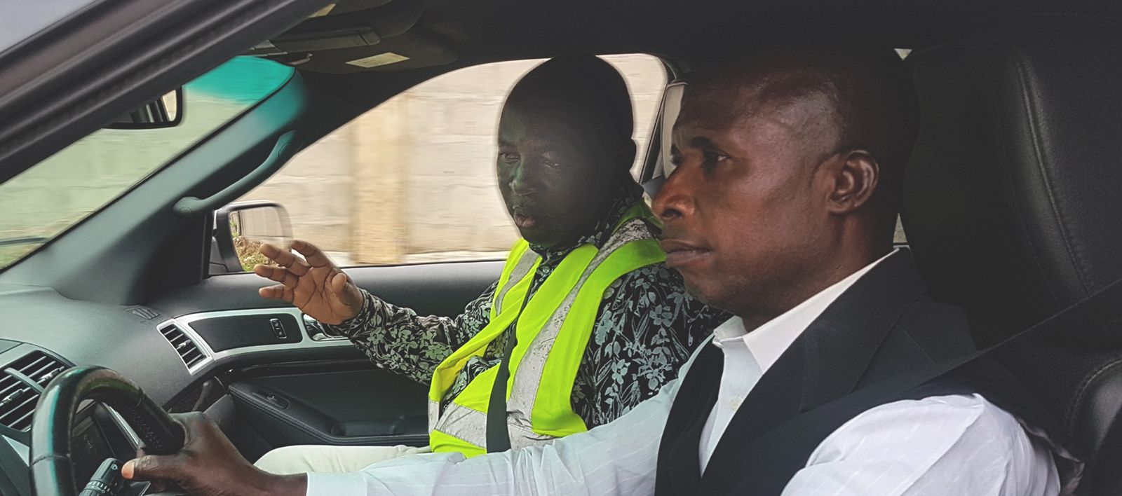 An I Drive Smart instructor coaching a driver behind the wheel