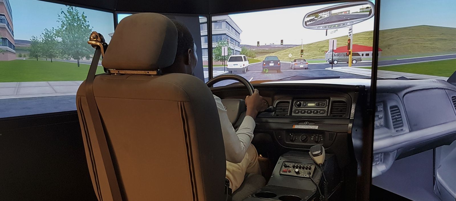 A student practising in the I Drive Smart driving simulator